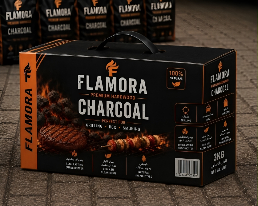 FLAMORA premium charcoal packaging on volcanic stone with glowing embers